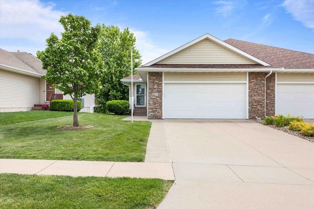 827 SW 46th St, Ankeny, IA 50023 - view of front of property featuring stone siding, driveway, a garage, a front yard, and roof with shingles