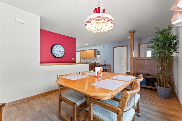 827 SW 46th St, Ankeny, IA 50023 - dining space featuring light wood-style floors, a chandelier, and recessed lighting