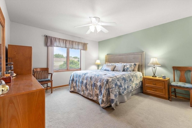 827 SW 46th St, Ankeny, IA 50023 - carpeted bedroom with ceiling fan and baseboards