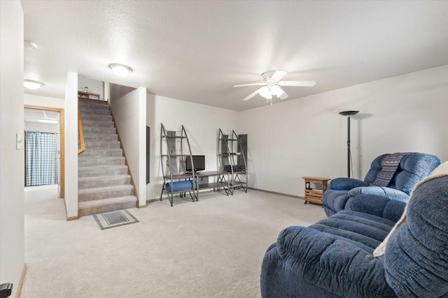 827 SW 46th St, Ankeny, IA 50023 - living area featuring carpet floors, stairs, and ceiling fan