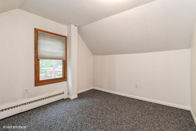 644 N 43rd St, Cumming, IA 50061 - bonus room featuring baseboard heating, lofted ceiling, and carpet floors