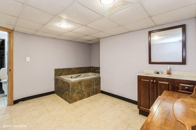 644 N 43rd St, Cumming, IA 50061 - full bathroom featuring a bath, vanity, and a drop ceiling