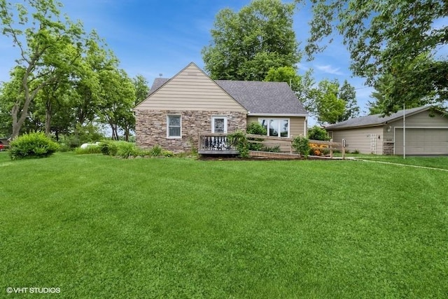 644 N 43rd St, Cumming, IA 50061 - view of front of property featuring a front yard, stone siding, a garage, and a chimney