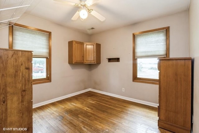 644 N 43rd St, Cumming, IA 50061 - spare room with hardwood / wood-style floors and a ceiling fan