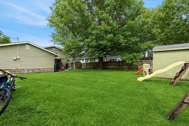 1525 Rapids St, Adel, IA 50003 - fenced backyard featuring a playground