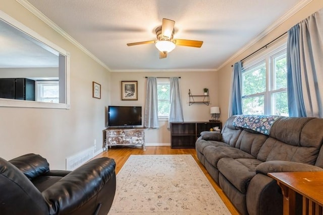 1525 Rapids St, Adel, IA 50003 - living room with wood finished floors, crown molding, and a ceiling fan