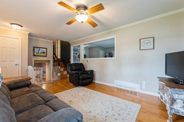 1525 Rapids St, Adel, IA 50003 - living area with ceiling fan, wood finished floors, and ornamental molding