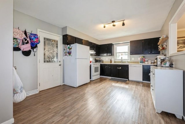 1525 Rapids St, Adel, IA 50003 - kitchen featuring white appliances, light wood-style flooring, and light countertops