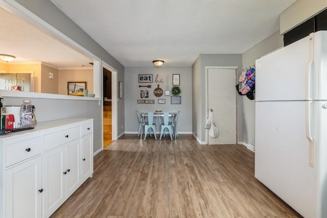 1525 Rapids St, Adel, IA 50003 - dining room featuring light wood-style flooring and baseboards