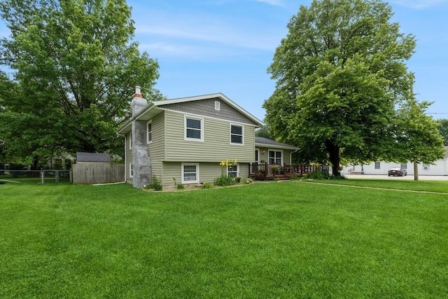 1525 Rapids St, Adel, IA 50003 - view of front of property with a chimney and a wooden deck