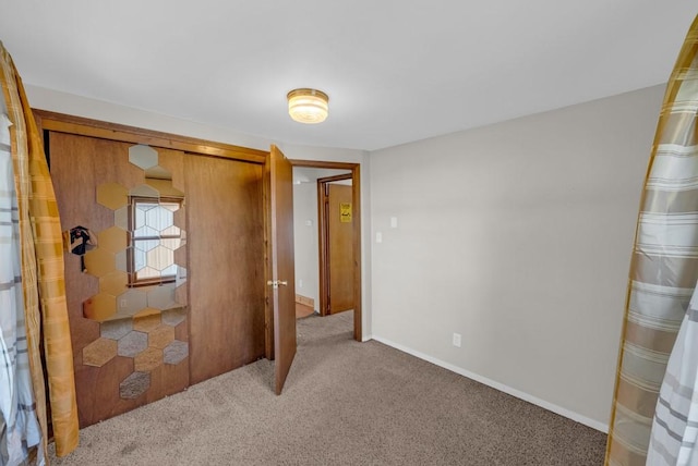 1107 E 12th St N, Newton, IA 50208 - unfurnished bedroom with carpet floors and a closet