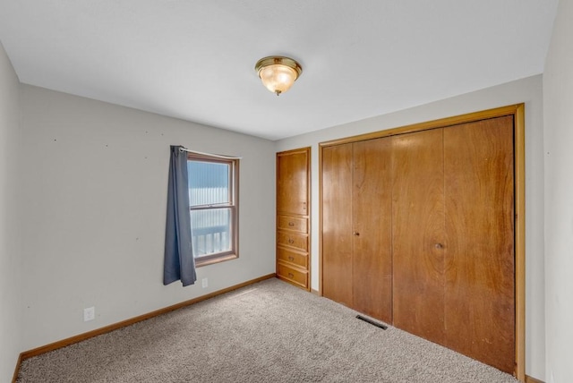 1107 E 12th St N, Newton, IA 50208 - unfurnished bedroom with carpet and a closet