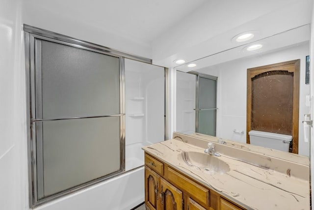 1107 E 12th St N, Newton, IA 50208 - bathroom with vanity, combined bath / shower with glass door, and recessed lighting