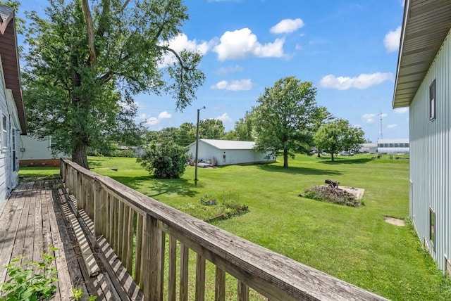 1107 E 12th St N, Newton, IA 50208 - wooden terrace featuring a lawn