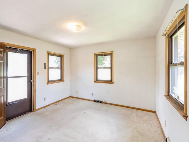 4041 Columbia St, Des Moines, IA 50313 - spare room featuring light colored carpet