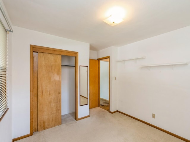 4041 Columbia St, Des Moines, IA 50313 - unfurnished bedroom with light colored carpet and a closet