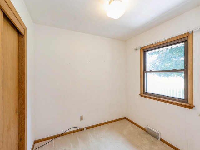 4041 Columbia St, Des Moines, IA 50313 - spare room featuring light carpet and baseboards