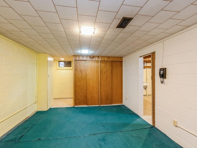 4041 Columbia St, Des Moines, IA 50313 - finished basement with dark colored carpet