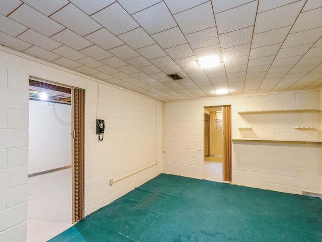 4041 Columbia St, Des Moines, IA 50313 - finished basement with carpet floors and concrete block wall