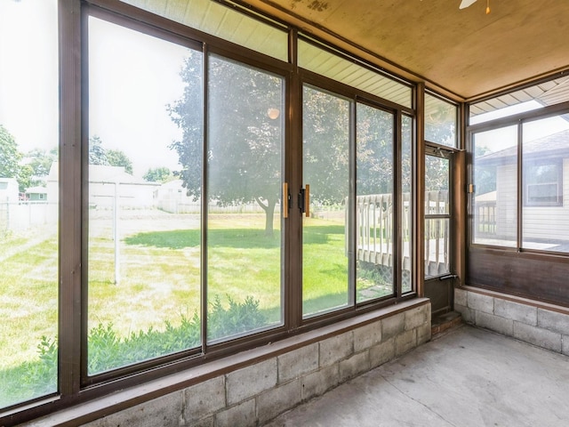 4041 Columbia St, Des Moines, IA 50313 - unfurnished sunroom featuring unfinished concrete floors