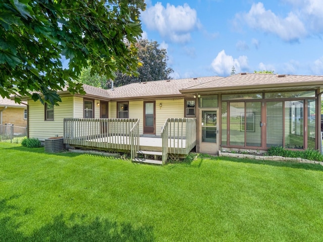 4041 Columbia St, Des Moines, IA 50313 - back of house featuring a deck, roof with shingles, and a sunroom