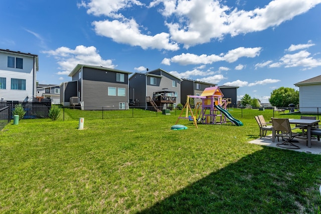1413 NE Park St, Grimes, IA 50111 - fenced backyard featuring a playground, a residential view, a patio, and cooling unit