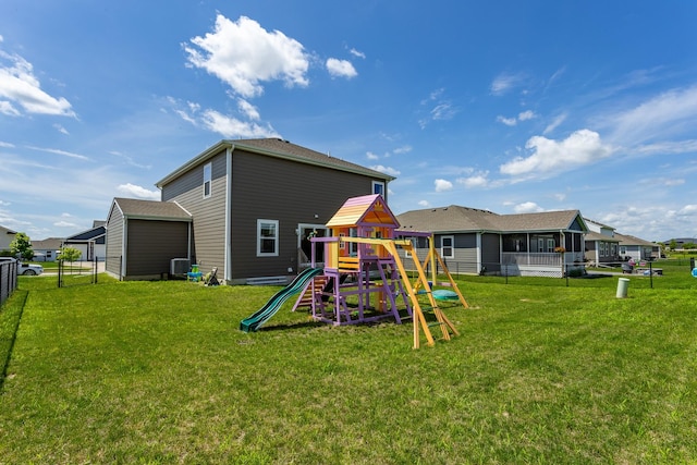1413 NE Park St, Grimes, IA 50111 - rear view of property with a playground and a residential view