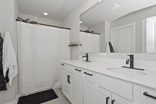 1413 NE Park St, Grimes, IA 50111 - full bath featuring double vanity and curtained shower
