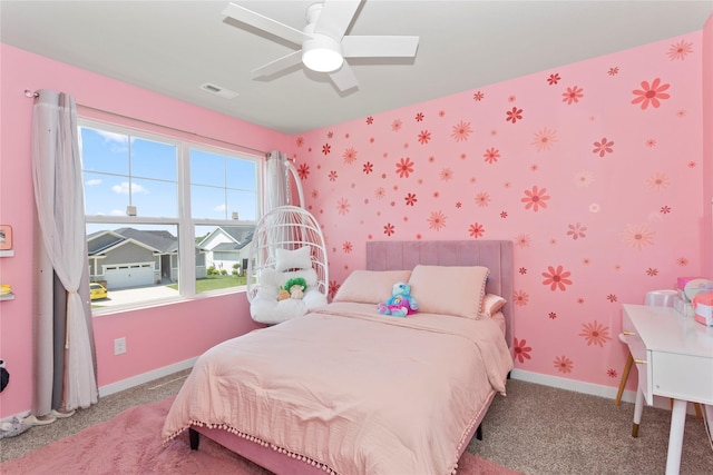 1413 NE Park St, Grimes, IA 50111 - carpeted bedroom featuring wallpapered walls and a ceiling fan