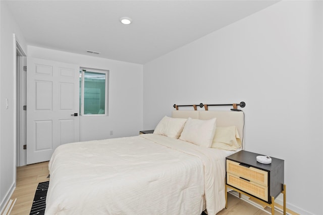 1413 NE Park St, Grimes, IA 50111 - bedroom featuring light wood-style flooring and recessed lighting