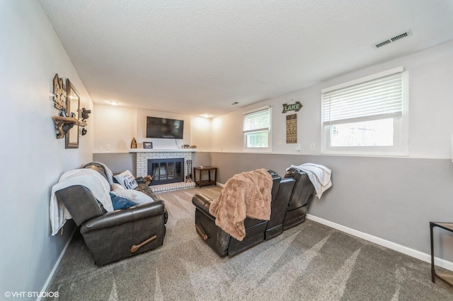 500 NW Valley View Dr, Grimes, IA 50111 - living room with a fireplace, carpet flooring, and a textured ceiling