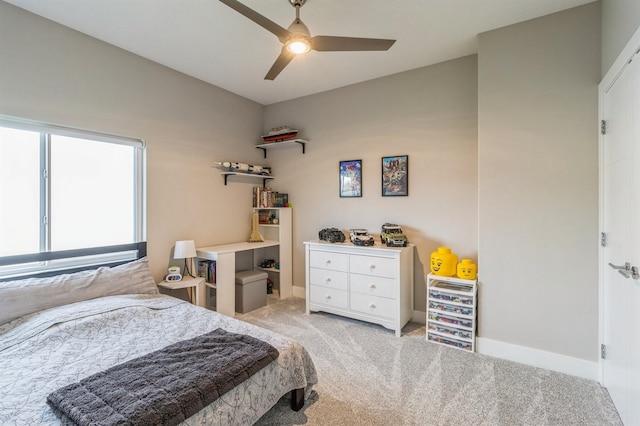 905 NE Badger Ln, Waukee, IA 50263 - carpeted bedroom featuring ceiling fan and baseboards