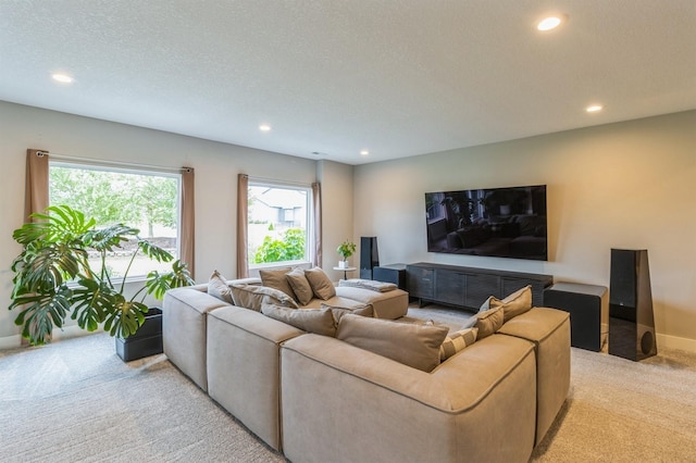 905 NE Badger Ln, Waukee, IA 50263 - living area featuring light carpet, recessed lighting, and a textured ceiling