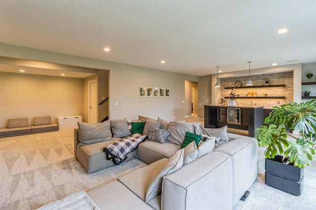 905 NE Badger Ln, Waukee, IA 50263 - living area with light colored carpet, recessed lighting, stairs, and a dry bar