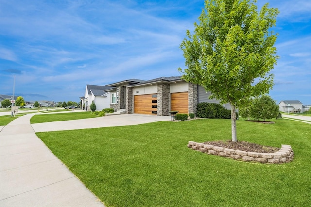 905 NE Badger Ln, Waukee, IA 50263 - view of front of property with stone siding, a garage, a front yard, and driveway