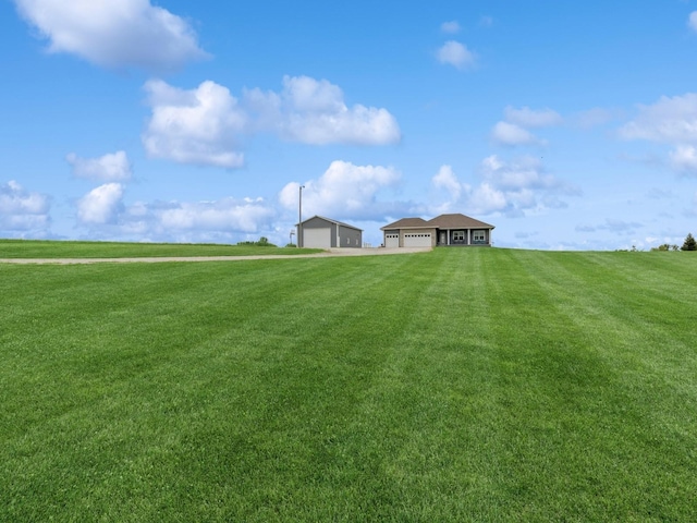 2458 SE 108th St, Runnells, IA 50237 - view of grassy yard with a garage