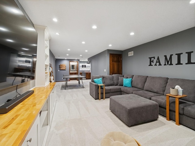 2458 SE 108th St, Runnells, IA 50237 - living room featuring light carpet and recessed lighting