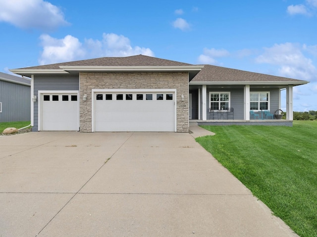 2458 SE 108th St, Runnells, IA 50237 - prairie-style house with an attached garage, driveway, a front lawn, stone siding, and roof with shingles