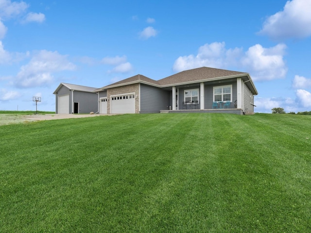 2458 SE 108th St, Runnells, IA 50237 - ranch-style home with a front lawn, a porch, and a garage
