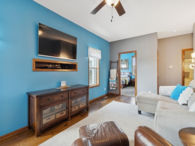 2458 SE 108th St, Runnells, IA 50237 - living room featuring ceiling fan and wood finished floors