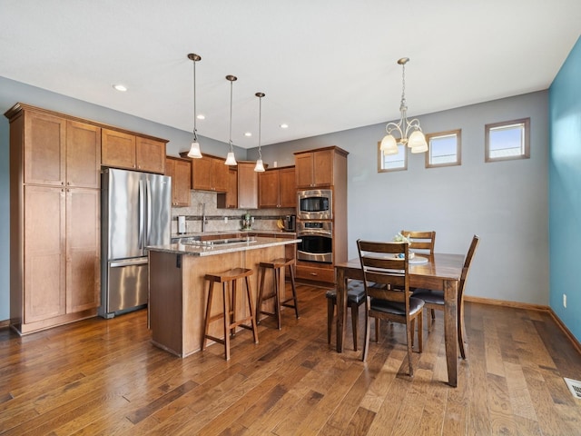 2458 SE 108th St, Runnells, IA 50237 - dining space featuring a chandelier, dark wood-style floors, and recessed lighting