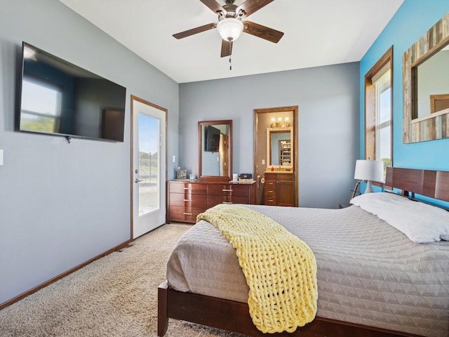 2458 SE 108th St, Runnells, IA 50237 - carpeted bedroom with access to exterior, multiple windows, and ceiling fan
