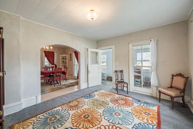 311 E 4th St, Riverside, IA 52327 - living area with arched walkways and carpet