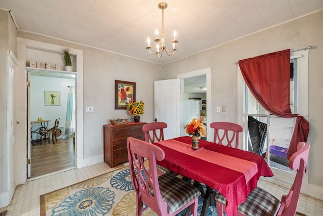 311 E 4th St, Riverside, IA 52327 - dining area featuring a chandelier and crown molding