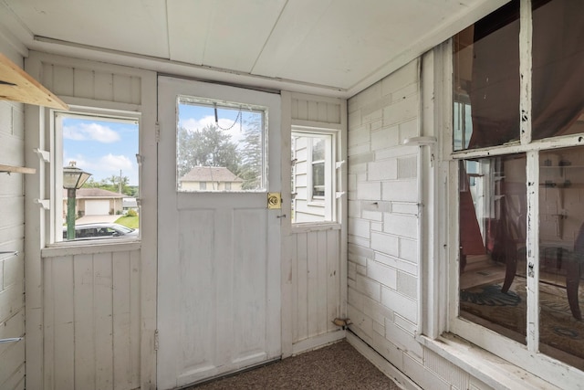 311 E 4th St, Riverside, IA 52327 - doorway featuring healthy amount of natural light and carpet floors