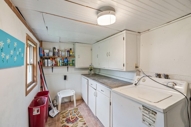 311 E 4th St, Riverside, IA 52327 - laundry area with washer / dryer, cabinet space, and light tile patterned flooring