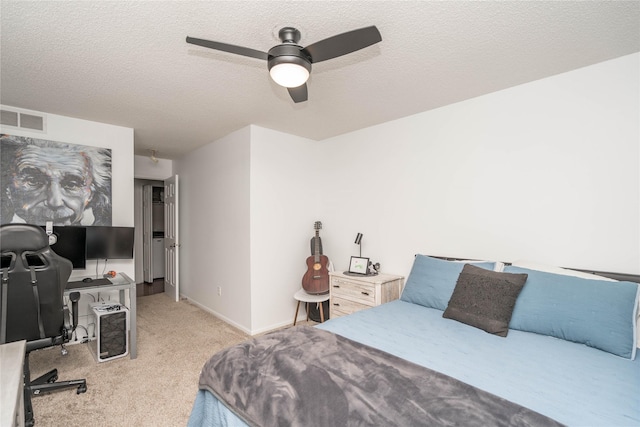150 S Prairie View Dr Unit 601, West Des Moines, IA 50266 - bedroom with carpet floors, a textured ceiling, and ceiling fan