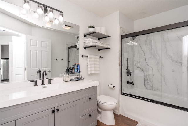 150 S Prairie View Dr Unit 601, West Des Moines, IA 50266 - full bathroom featuring vanity, enclosed tub / shower combo, and wood finished floors
