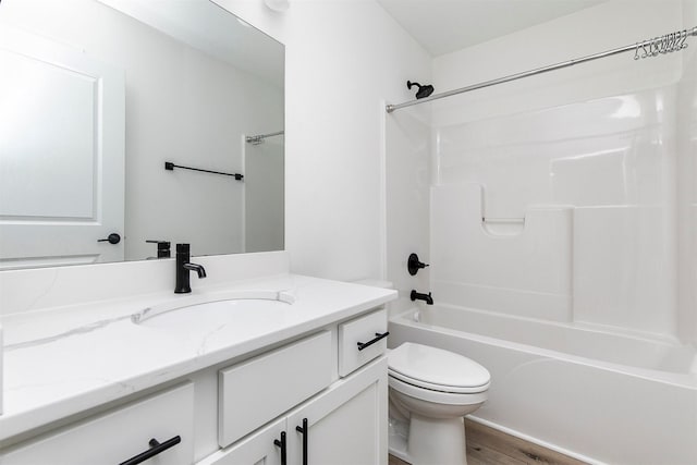 427 Spring Crest Ln, Waukee, IA 50263 - bathroom featuring vanity, washtub / shower combination, and wood finished floors
