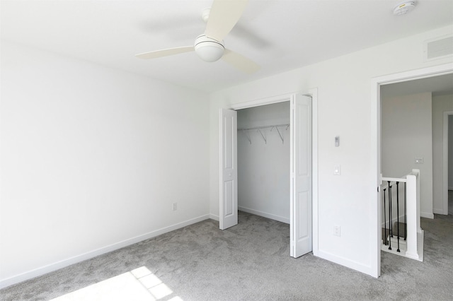 427 Spring Crest Ln, Waukee, IA 50263 - unfurnished bedroom with carpet floors, a ceiling fan, and a closet